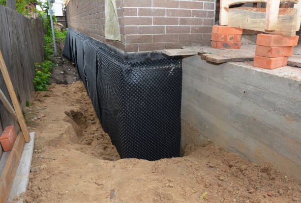 SJ Waterproofing Pros technician performing targeted Interior Drainage System assessment in Vance, AL